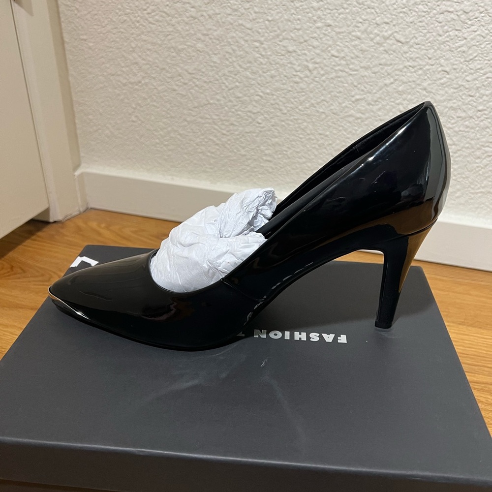 Black patent leather heels. Never worn, good for wide feet.